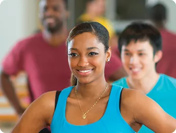 Smiling woman participating in an exercise class